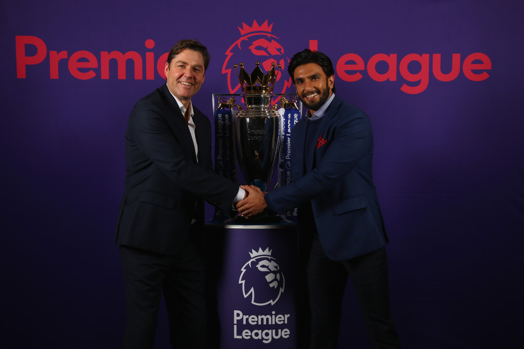 LONDON, ENGLAND - DECEMBER 22: The Premier League Managing Director, Richard Masters and Actor Ranveer Singh pose with the Premier League Trophy during a photo call to mark his appointment as a Premier League ambassador on December 22, 2017 in London, England. (Photo by Sachin Murdeshwar /GPN Images for Premier League)