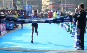 Ethiopia's Shuko Genemo crosses the finish Line in SCMM 2016 t won the Elite Women's Title