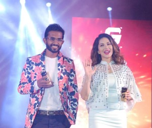 Bollywood actress Sunny Leone seen with Rahul Vinayika, MD of RZ International Pvt Ltd during the launch of Gold Fogg, an energy drink in Bengaluru on Sunday