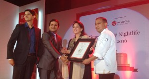 (L - R) Chef de Cuisine Mihir Kane, Executive Chef Pradipt Sinha and Junior Sous Chef Akhilesh Pathak receive the award from Nikhat Khan Hegde