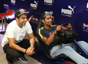 Armaan, the motorsport man of the year challenging Gurkeerat to try out the Redbull simulator that was installed at the event.-PHOTO BY GPN NETWORK