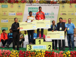 VIRAR (GPN) : The overall men's half marathon winners Baliappa AB, Srinu Bugatha, Damor Mohan along with Umesh Naik, Deputy Mayor of Vasai-Virar Municipal Corporation and Baliram Jadhav, Ex, MP.- By Sachin Murdeshwar GPN NETWORK. 