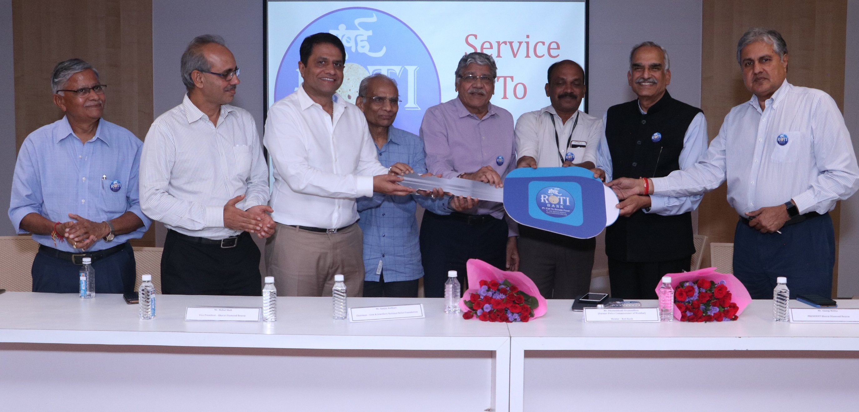 Mr Anoop Mehta, President, Bharat Diamond Bourse, Mr Sanjay Kothari, Chairman, Gems and Jewellery National Relief Foundation (GJNRF), Mr Kirit Bhansali, Member BDB and GJNRF, along with other dignitaries at a function held at the Bharat Diamond Bourse (BDB) in Mumbai to donate 2 vans to the Roti Bank, a non-profit organisation which thrives to make the city free of hunger and excess food to be delivered to the needy people. Shri D Sivanandhan, Mentor Roti Bank, former Commissioner of Police, Mumbai receiving the van keys.- Photo By GPN