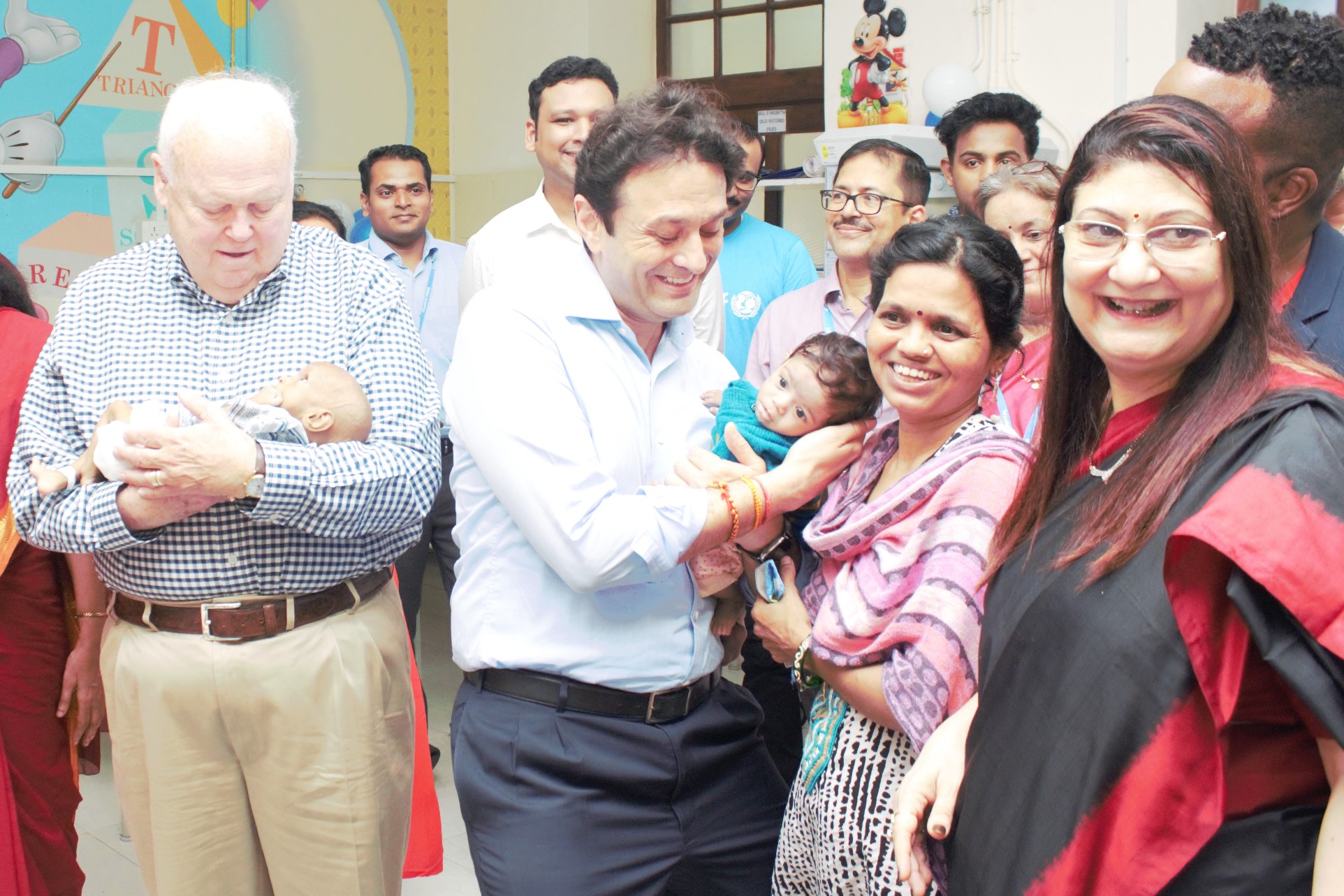 Jim Morris and Mr.Ness Wadia holding kids during the inauguration of Nutrition Rehabilitation centre - Photo By Sachin Murdeshwar GPN