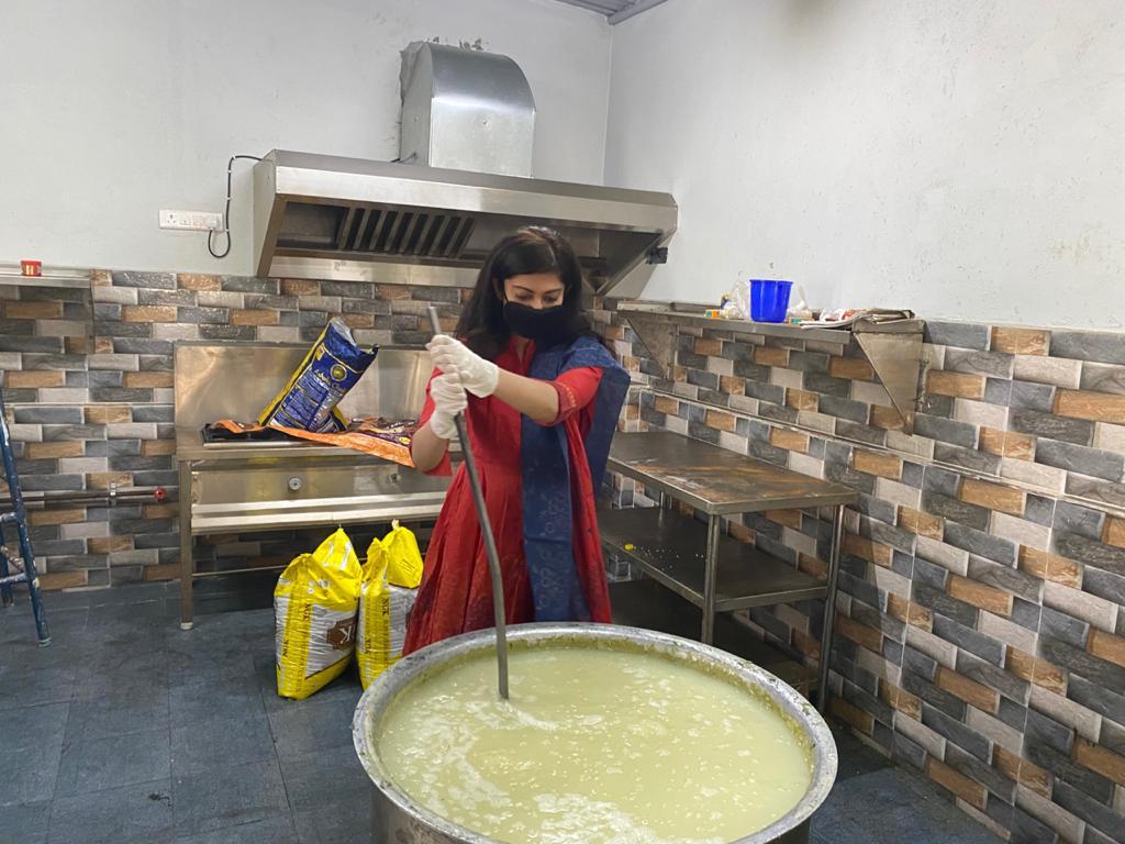 Actress Pranitha Subhash helping in preparation of meals and packing food boxes for daily wage workers and migrants.- Photo By GPN