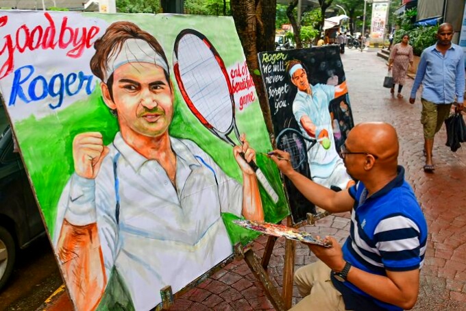 A student from Gurukul art school makes a painting to pay tribute to tennis player Roger Federer, who announced his retirement from tennis on Thursday, in Mumbai, Friday, Sept. 16, 2022.