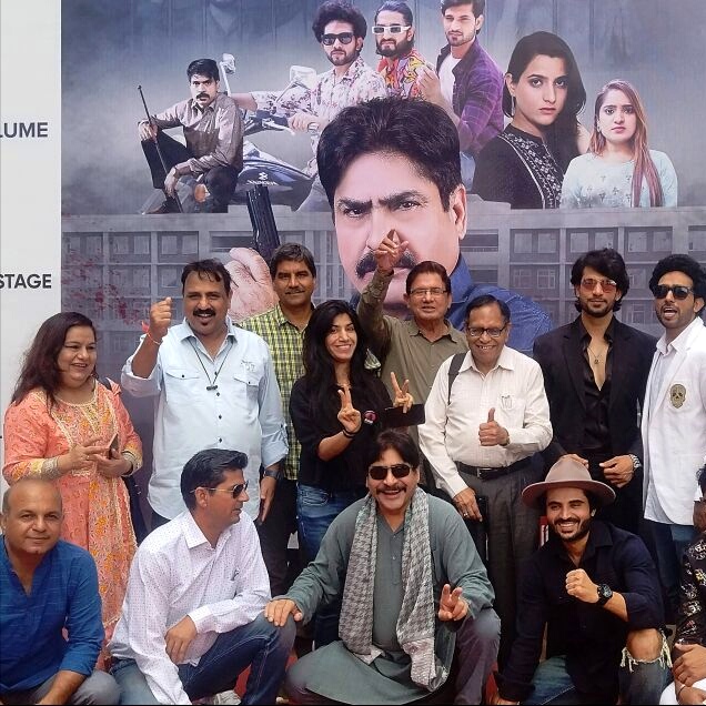 Bollywood actor Yashpal Sharma with others poses for photos during a promotional event for his web series 'College Kaand', in Gurugram, Friday, Sept. 16, 2022.
