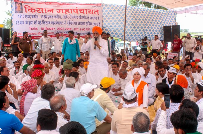 Farm leaders and farmers participate in a 'mahapanchayat' demanding compensation against acquisition of their land by the Haryana government, at Pachgaon Chowk in Gurugram, Sunday, Sept. 18, 2022.