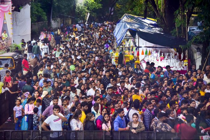 Devotees wait to offer prayers outside Mount Mary church during the last day of the annual Mount Mary fair at Bandra, in Mumbai, Sunday, Sept. 18, 2022.